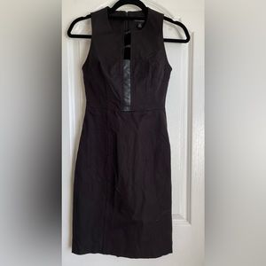 Sleeveless black dress with leather stripes